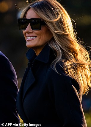 The images taken of the first lady (above) revived conspiracy theories online that a body double was used for a photo op